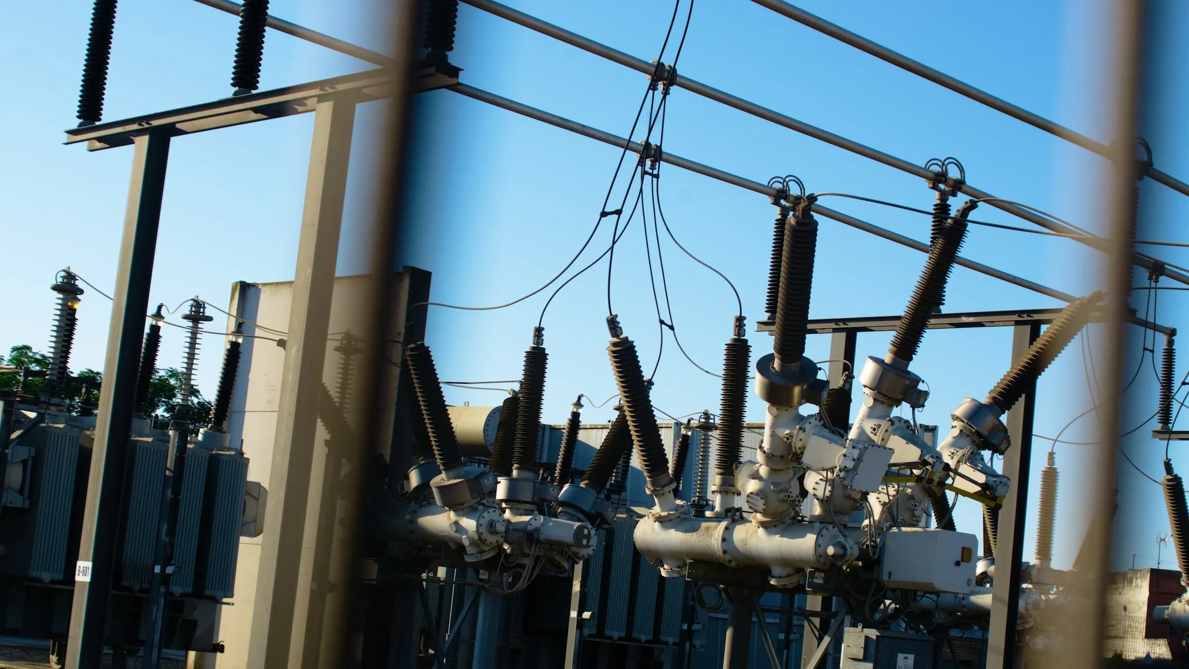 High-voltage electrical substation with transformers and power lines